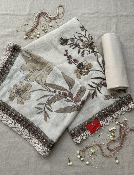Embroidered mul fabric with floral patterns on a textured surface